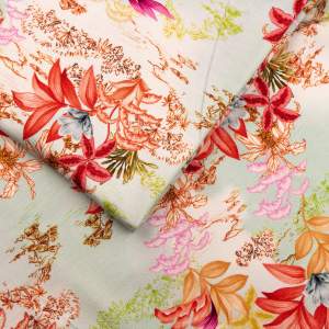 Dzianina bawełniana GOTS wzór kwiaty na miętowym tle