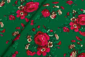 Tkanina kelly krepa wzór ludowy na zielonym tle