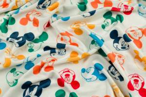 Dzianina Velvet soft ubraniowy wzór kolorowe myszka miki na kremowym tle